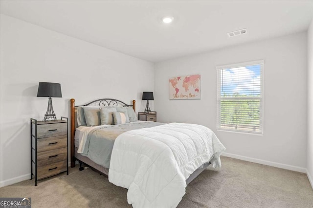 carpeted bedroom featuring baseboards