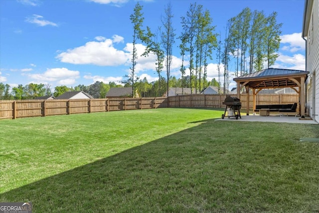 view of yard with a gazebo and a patio