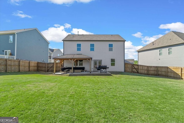 back of house with a gazebo, a patio area, and an outdoor hangout area