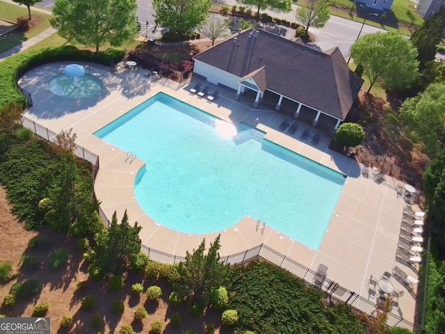 community pool featuring fence