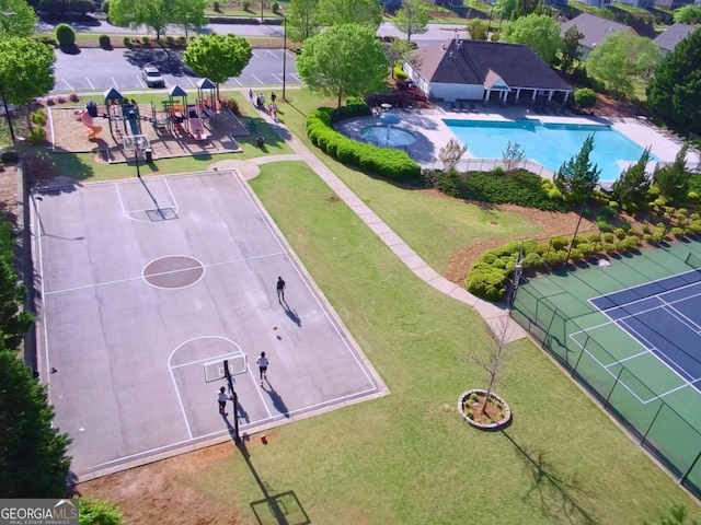 drone / aerial view of a pool area and a community park