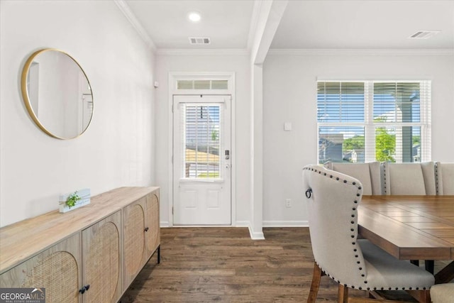 entryway with dark wood-style floors, crown molding, baseboards, and recessed lighting