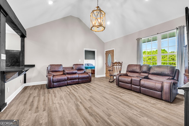 living area featuring recessed lighting, a notable chandelier, high vaulted ceiling, baseboards, and wood finished floors