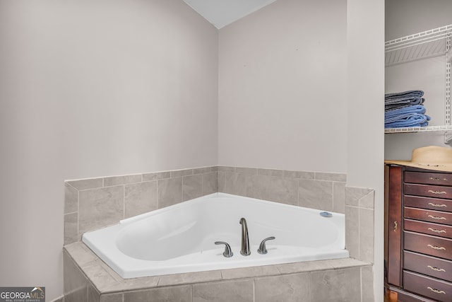 full bath with a garden tub