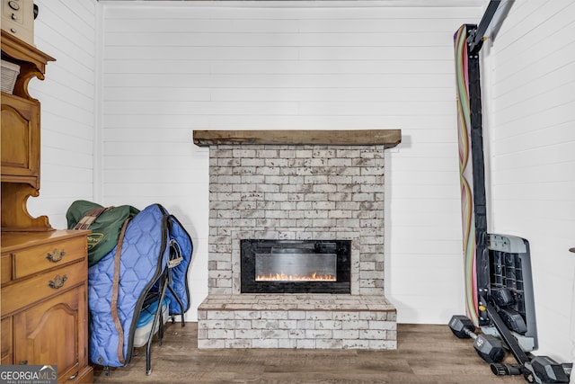 room details featuring wood finished floors and a fireplace