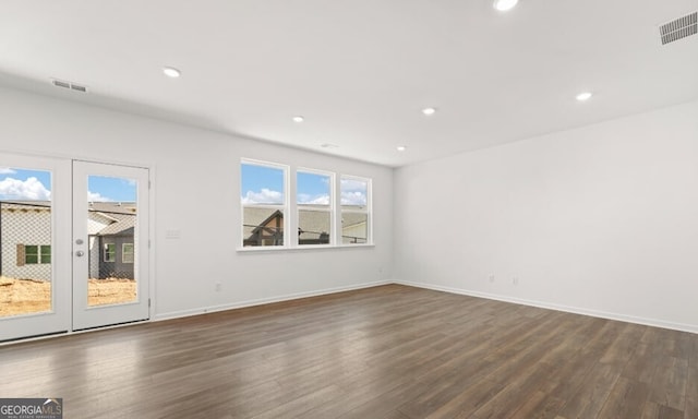 unfurnished room featuring dark wood-type flooring, visible vents, french doors, and recessed lighting