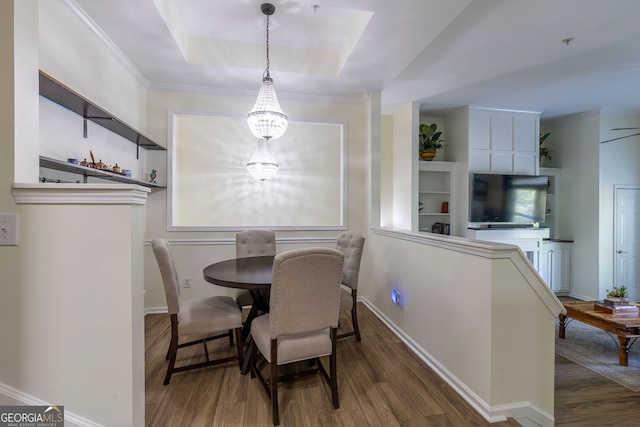 4246 River Green Dr Unit 202, Atlanta, GA 30327 - dining room featuring wood finished floors, a chandelier, and a raised ceiling