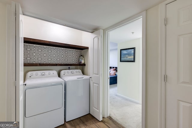 4246 River Green Dr Unit 202, Atlanta, GA 30327 - washroom with wood finished floors and washing machine and clothes dryer