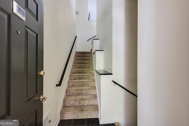 4246 River Green Dr Unit 202, Atlanta, GA 30327 - stairway with baseboards and tile patterned flooring