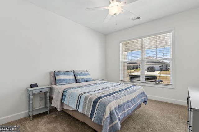 166 Verano St, Kingsland, GA 31548 - carpeted bedroom with baseboards and ceiling fan