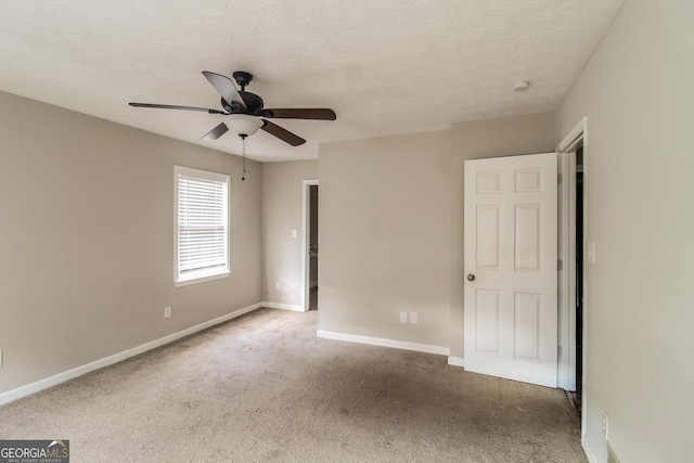 6024 S Deshon Ct, Lithonia, GA 30058 - unfurnished bedroom featuring carpet floors, a textured ceiling, and ceiling fan
