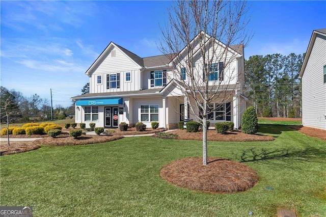 view of front of property with board and batten siding and a front yard