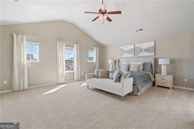 carpeted bedroom with lofted ceiling, visible vents, a ceiling fan, and baseboards