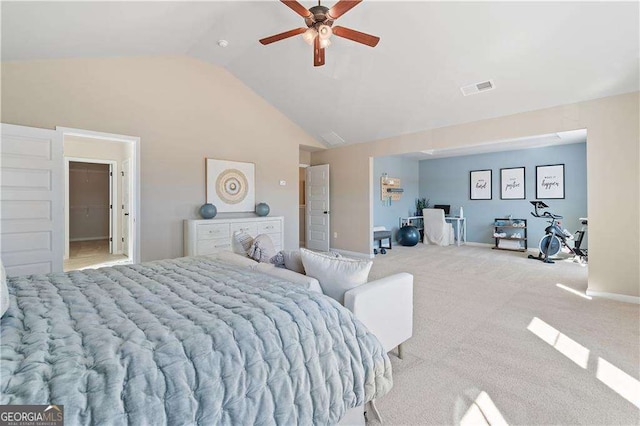 bedroom with a ceiling fan, vaulted ceiling, carpet floors, and visible vents