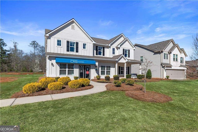view of front of property featuring board and batten siding and a front lawn
