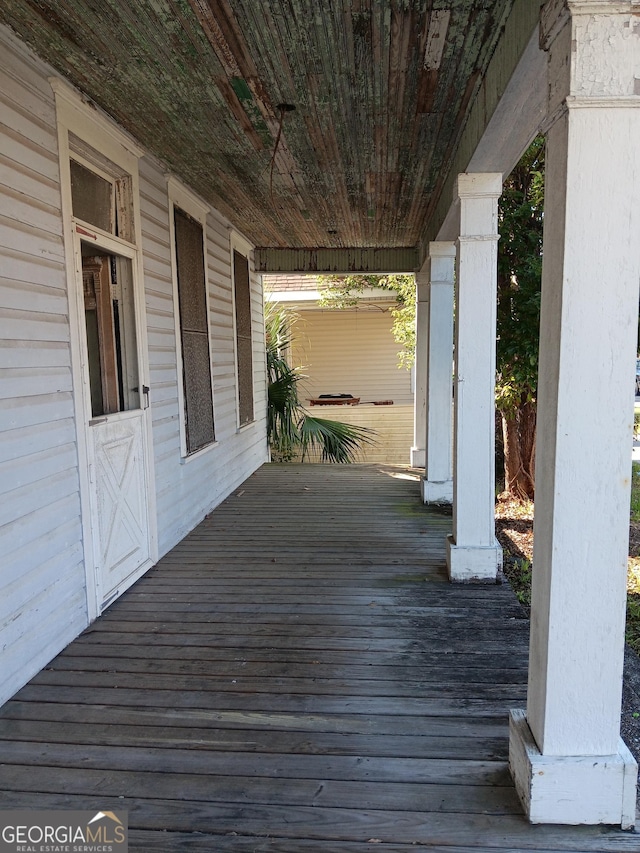506 Mcdonald St, Waycross, GA 31503 - wooden deck featuring covered porch