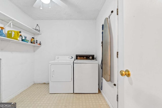 washroom featuring a textured ceiling, washing machine and dryer, ceiling fan, light floors, and laundry area