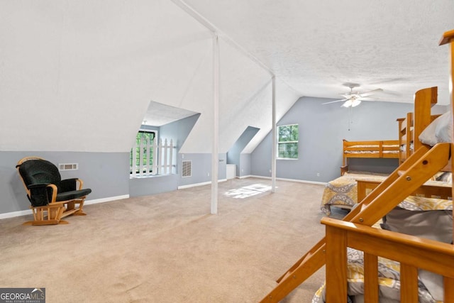 bedroom featuring vaulted ceiling, carpet floors, visible vents, and baseboards