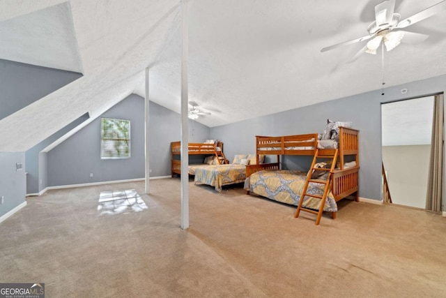 bedroom with carpet floors, lofted ceiling, and baseboards