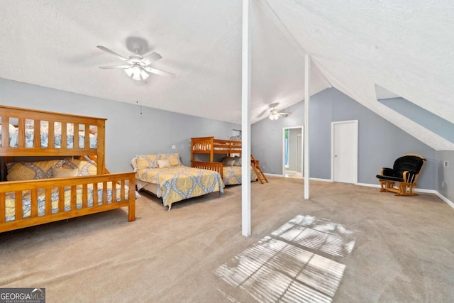 bedroom featuring a textured ceiling, vaulted ceiling, baseboards, carpet, and a ceiling fan