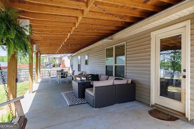 view of patio with fence, outdoor lounge area, and outdoor dining space