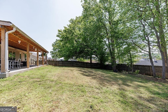 view of yard with a patio area and a fenced backyard