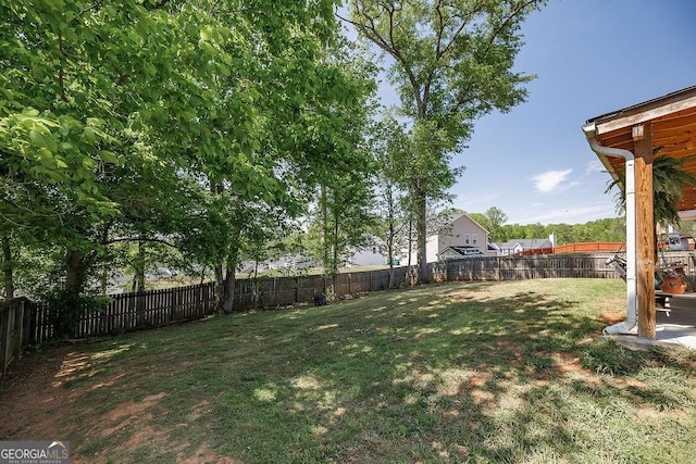 view of yard featuring a fenced backyard