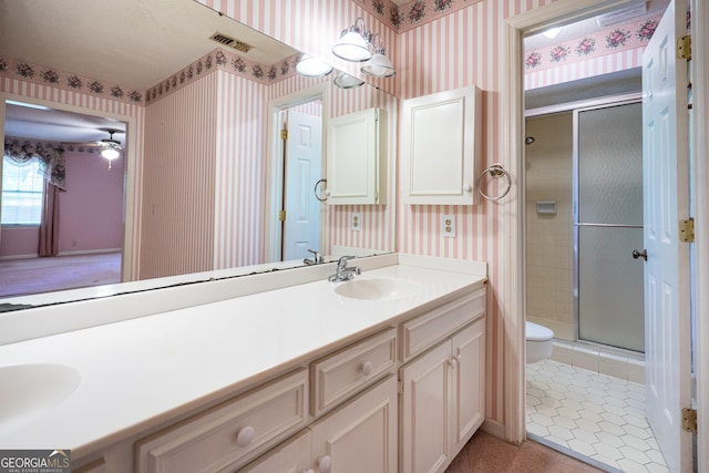 full bath featuring wallpapered walls, visible vents, and a shower stall