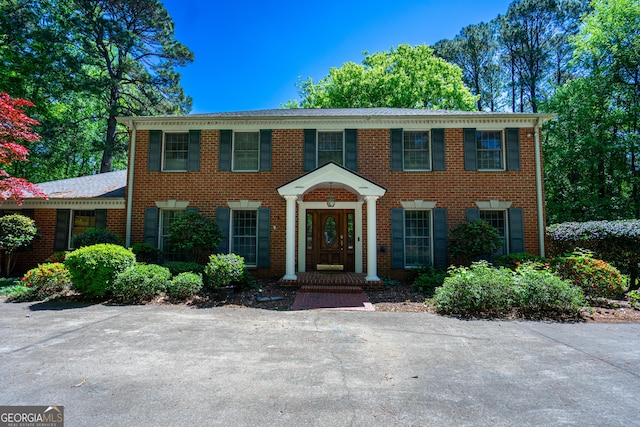 colonial house with brick siding
