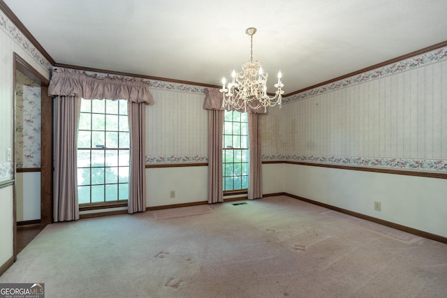 carpeted spare room with a chandelier, wallpapered walls, a healthy amount of sunlight, and baseboards