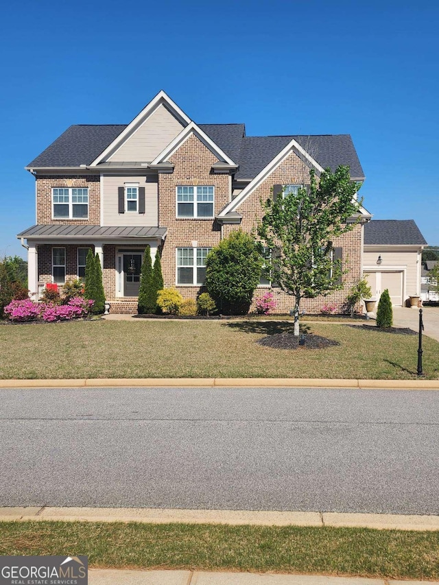 134 Sierra Cir, Woodstock, GA 30188 - craftsman-style house featuring concrete driveway, a front lawn, brick siding, and a garage