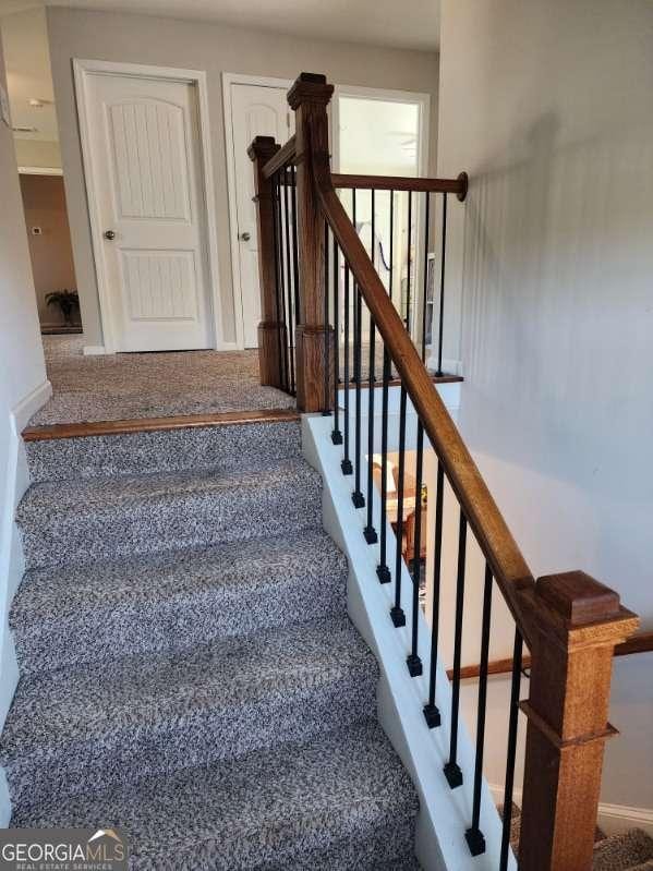 134 Sierra Cir, Woodstock, GA 30188 - stairs with carpet and baseboards