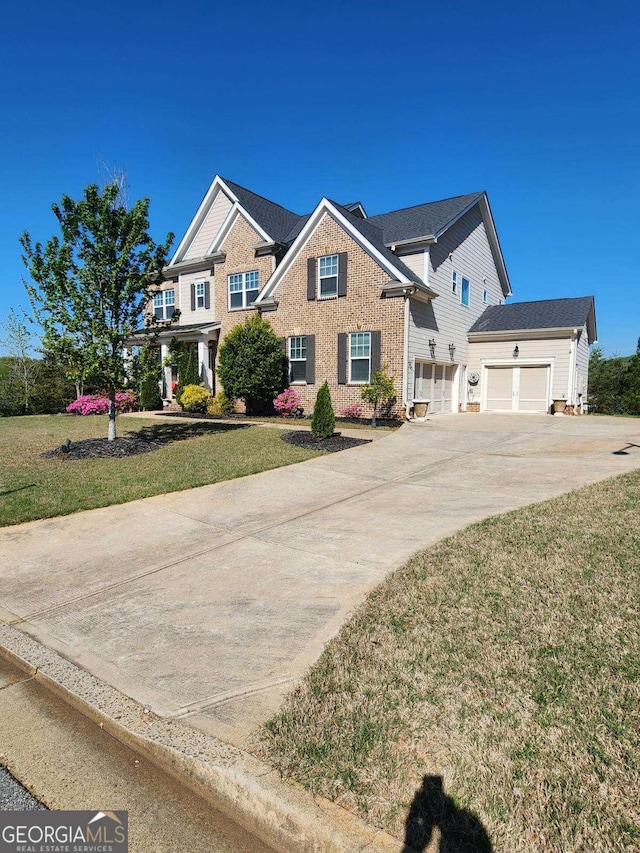 134 Sierra Cir, Woodstock, GA 30188 - view of front of property with driveway, a garage, and a front yard