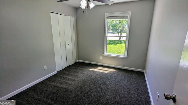 685 Greenhedge Dr, Stone Mountain, GA 30088 - unfurnished bedroom featuring carpet, a closet, and a ceiling fan