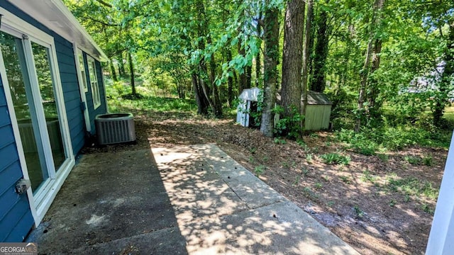 685 Greenhedge Dr, Stone Mountain, GA 30088 - view of yard featuring a storage shed and a patio area