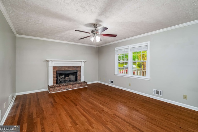 1320 Pinyon Pl, Lawrenceville, GA 30043 - unfurnished living room featuring wood finished floors, a ceiling fan, a brick fireplace, a textured ceiling, and visible vents