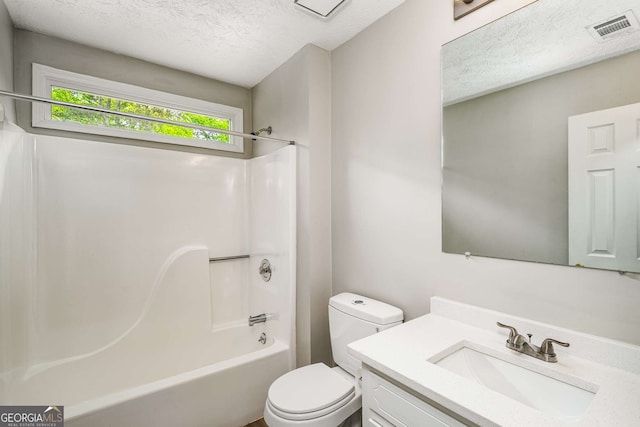 1320 Pinyon Pl, Lawrenceville, GA 30043 - full bath featuring toilet,  shower combination, a textured ceiling, visible vents, and vanity