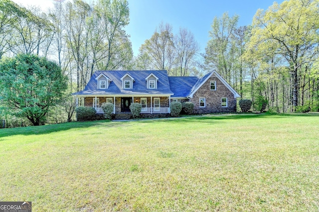 5800 S Richland Creek Rd, Buford, GA 30518 - new england style home featuring stone siding, a front lawn, and covered porch