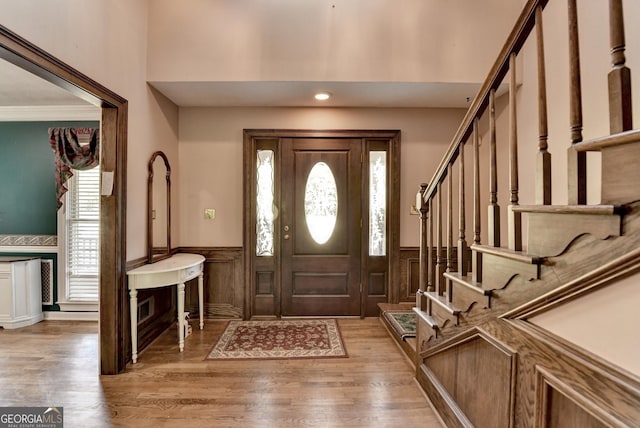 5800 S Richland Creek Rd, Buford, GA 30518 - foyer with wainscoting, a wealth of natural light, light wood-style floors, and stairway