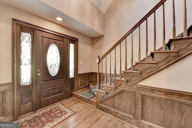 5800 S Richland Creek Rd, Buford, GA 30518 - entrance foyer with a wainscoted wall, wood finished floors, recessed lighting, and stairway