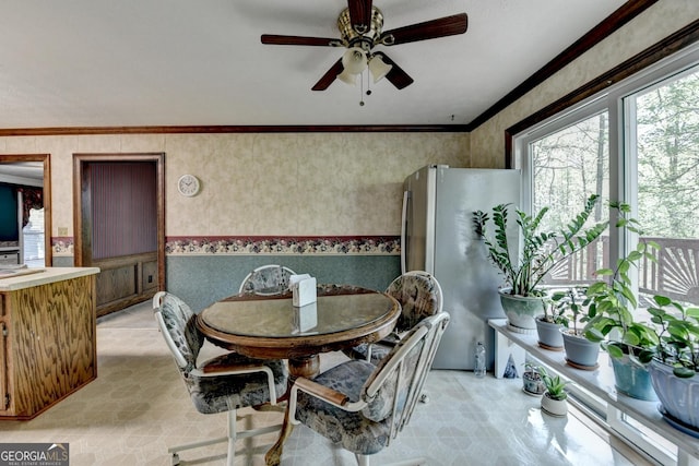 5800 S Richland Creek Rd, Buford, GA 30518 - dining room with wallpapered walls, a ceiling fan, and crown molding