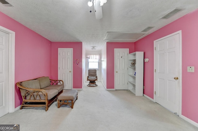5800 S Richland Creek Rd, Buford, GA 30518 - sitting room featuring attic access, a textured ceiling, carpet, and visible vents