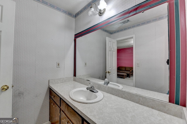 5800 S Richland Creek Rd, Buford, GA 30518 - bathroom with wallpapered walls, visible vents, and vanity
