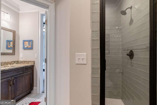 full bath with a shower stall, crown molding, and vanity