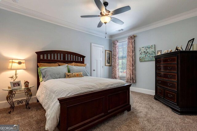 bedroom featuring crown molding, ceiling fan, light colored carpet, baseboards, and visible vents