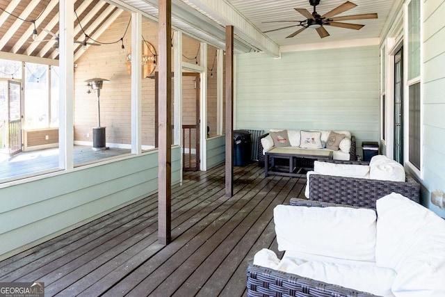 sunroom / solarium with an outdoor hangout area, ceiling fan, and beam ceiling