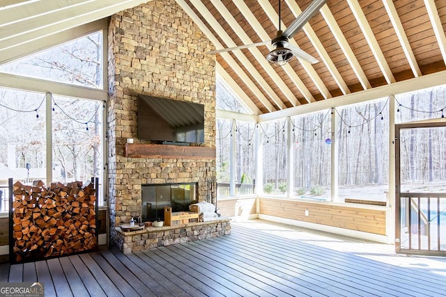 unfurnished sunroom with beam ceiling and a healthy amount of sunlight