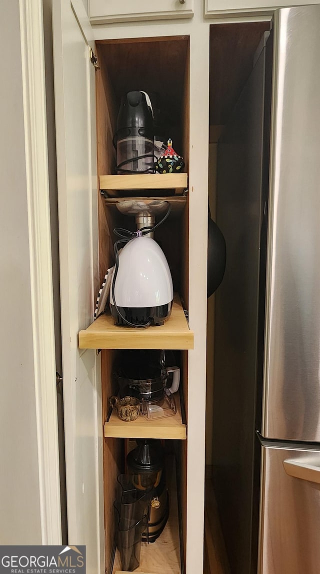 details featuring freestanding refrigerator