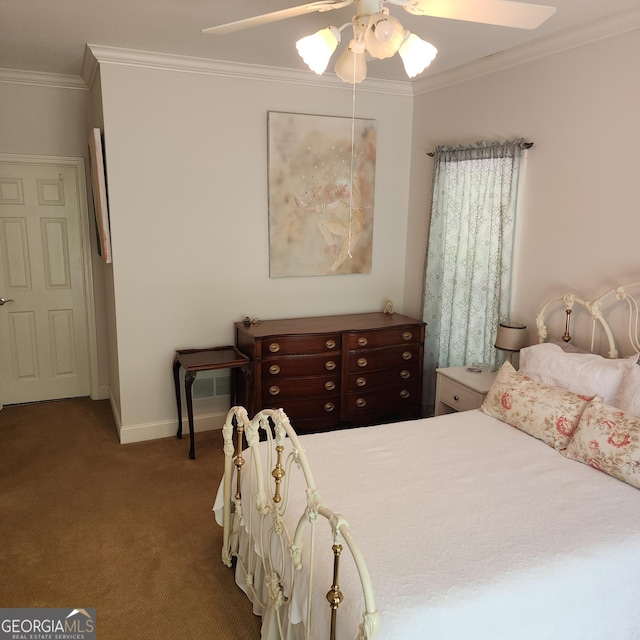 bedroom featuring crown molding, baseboards, carpet floors, and ceiling fan