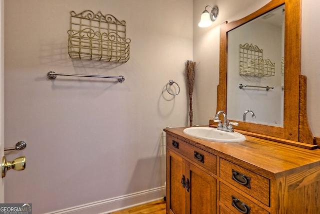 327 Kissimmee Trl, Cornelia, GA 30531 - bathroom with vanity, wood finished floors, and baseboards
